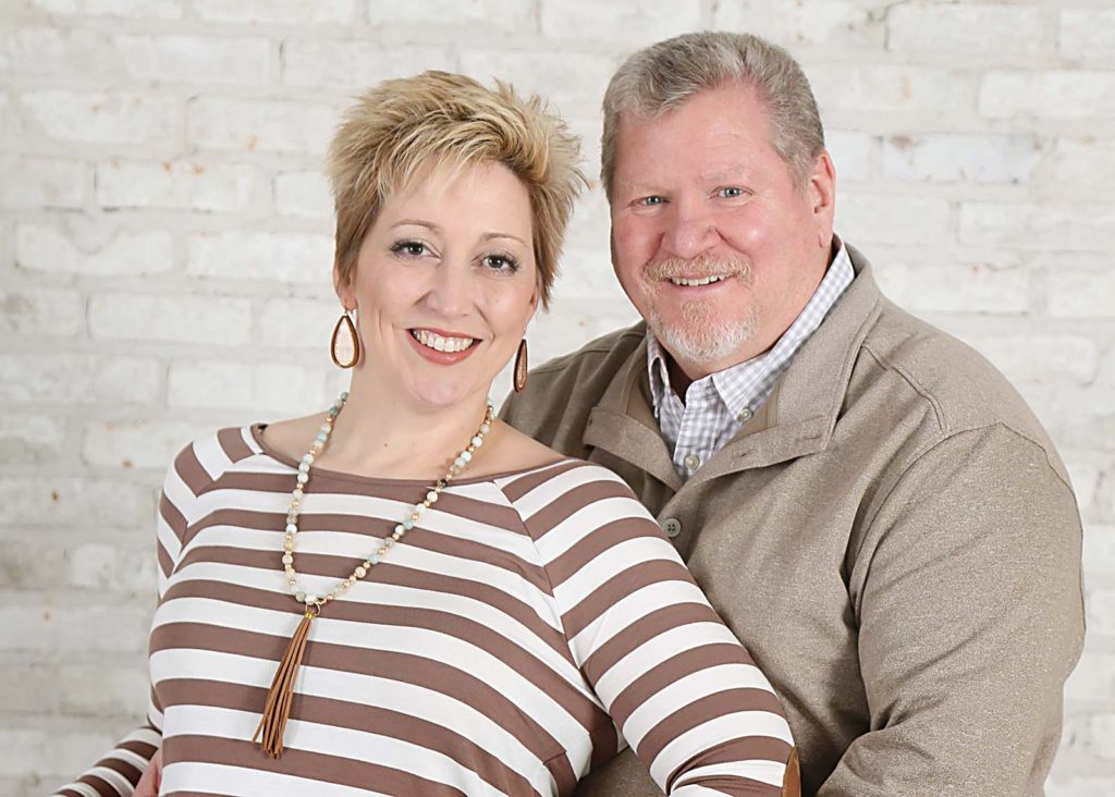 Misty Green, owner of Life is Better with Doodles and her husband.